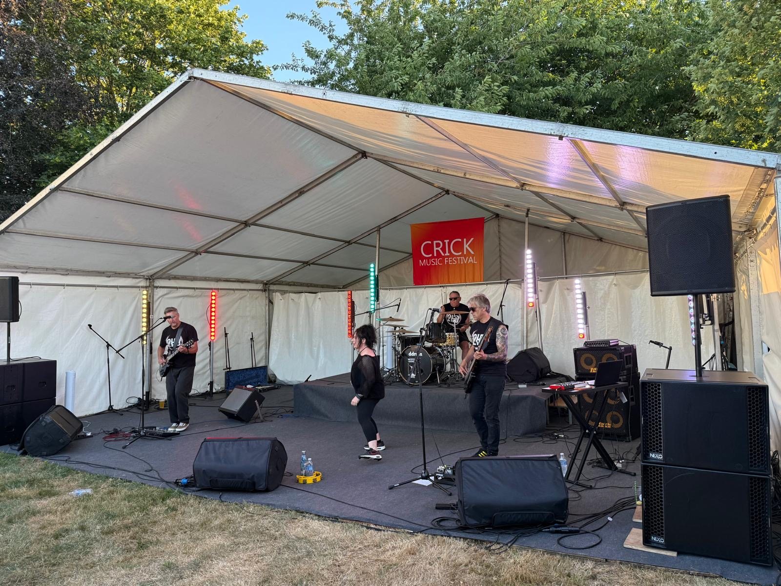 2HD performing at an outdoor event stage